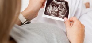 When does the fetus move in its mother's womb?